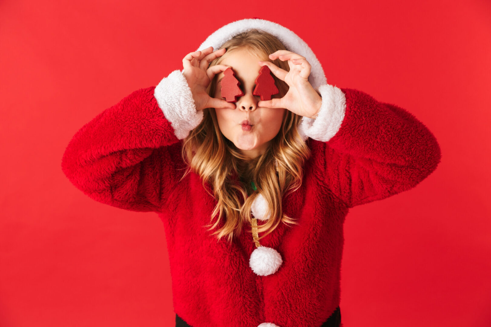 Cheerful girl wearing a holiday outfit