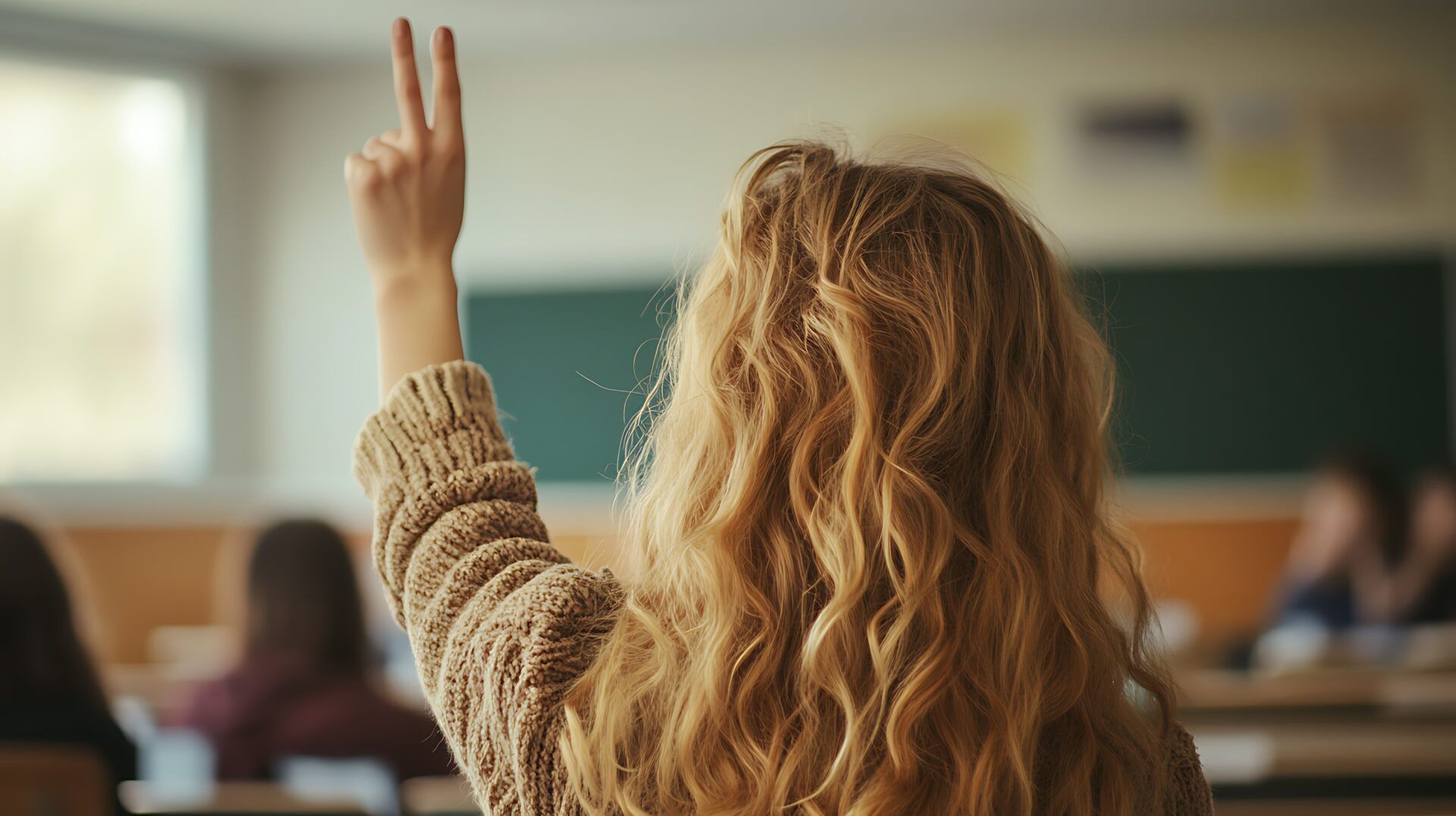 Girl in class learning her legacy from business leaders